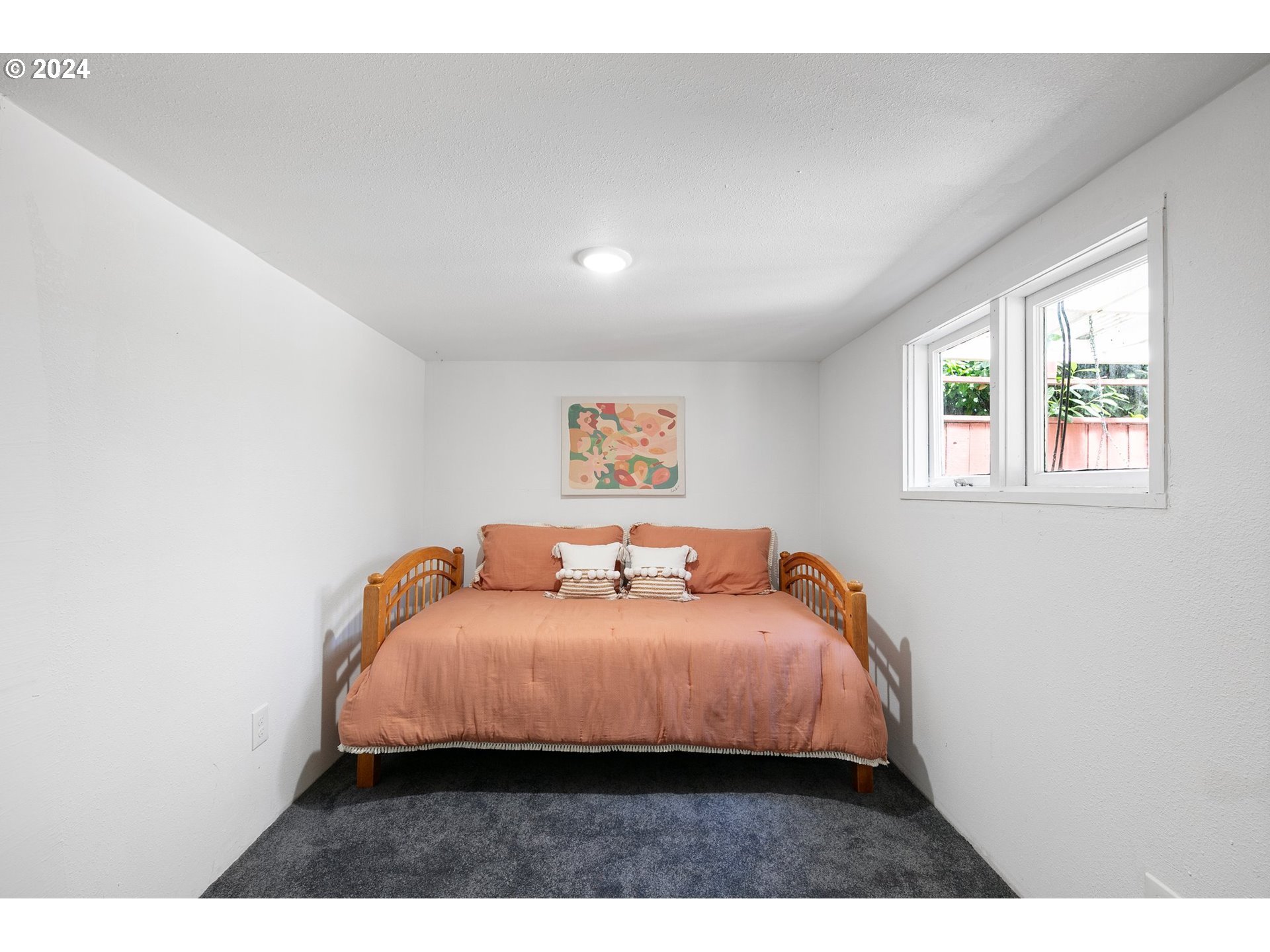 2919 Jefferson Street Eugene, OR 97405 - Photo 24 of 38 a bedroom with a bed and a window