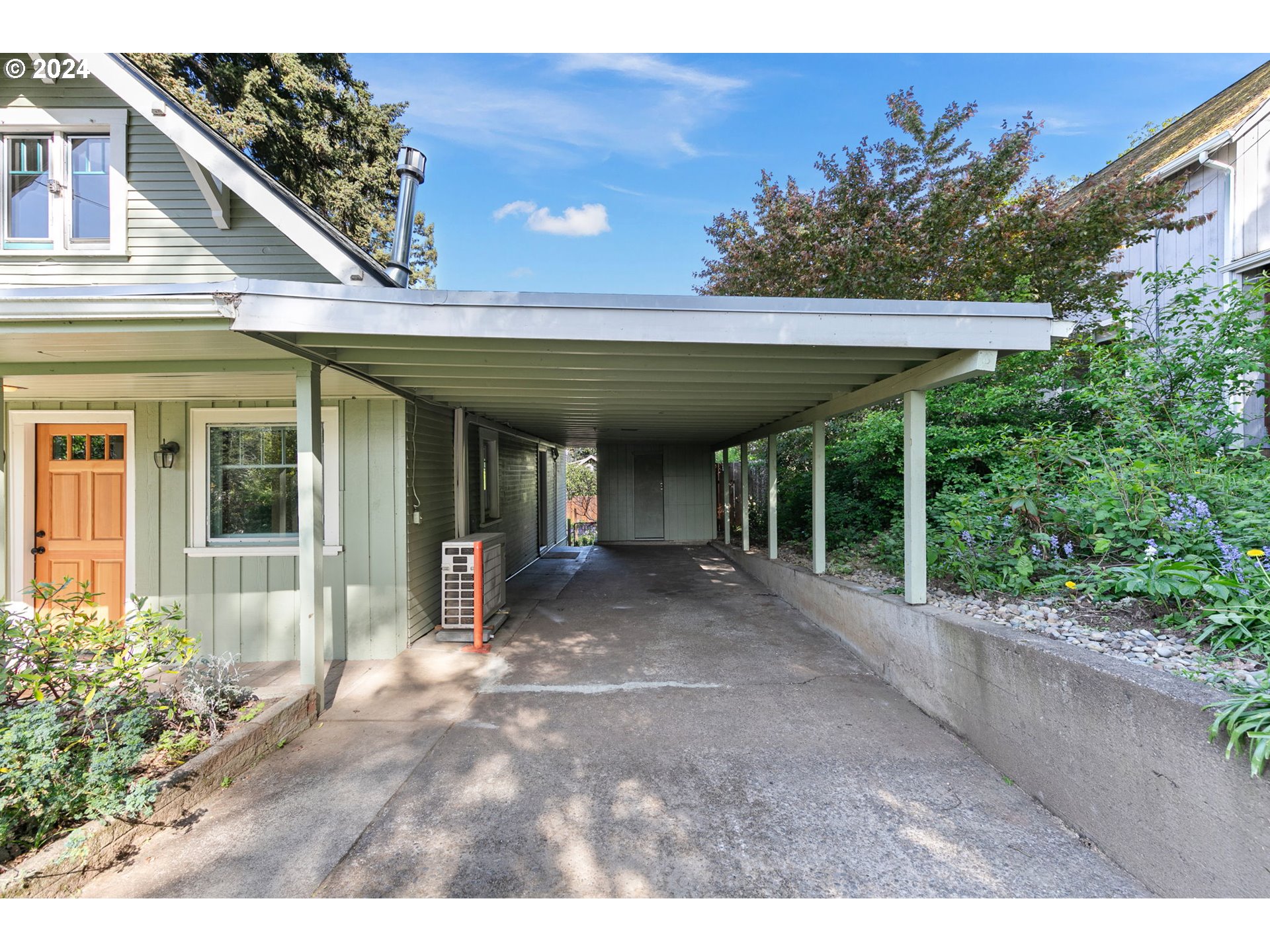 2919 Jefferson Street Eugene, OR 97405 - Photo 3 of 38 a view of a patio with table and chairs under an umbrella