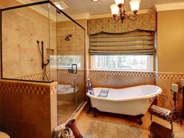 13709 Possum Track Road Raleigh, NC 27614 - Photo 7 of 12 Beautiful Newly Renovated Master Bath! Fully tiled shower with dual shower heads and the soaking tub is so inviting! Tile floors and custom vanity as well! WHAT A BATHROOM!