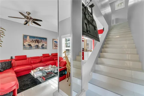 a view of a living room with furniture and a flat screen tv