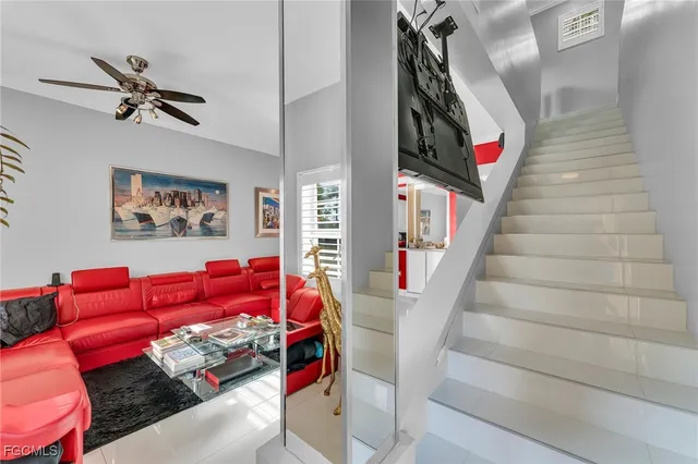 a view of a living room with furniture and a flat screen tv