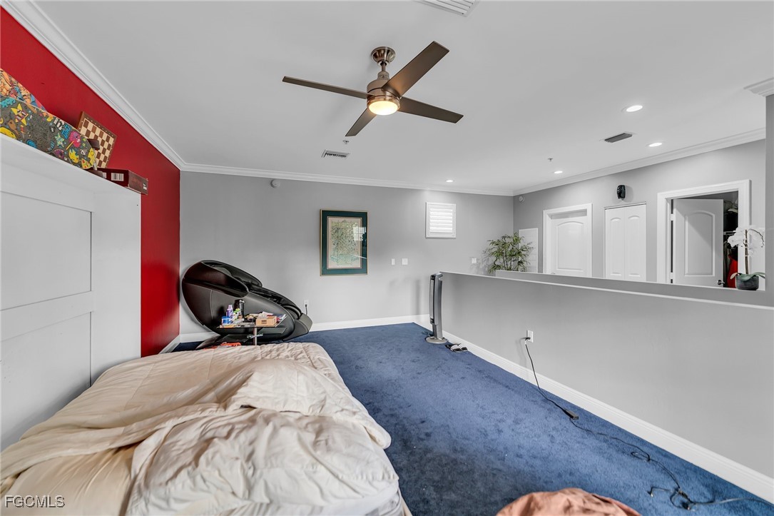 2080 West First Street, Unit 109 Fort Myers, FL 33901 - Photo 20 of 47 a bedroom with a bed and window