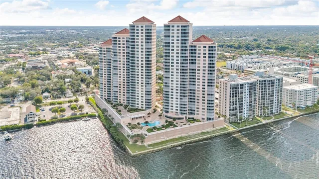 an aerial view of a house with outdoor seating