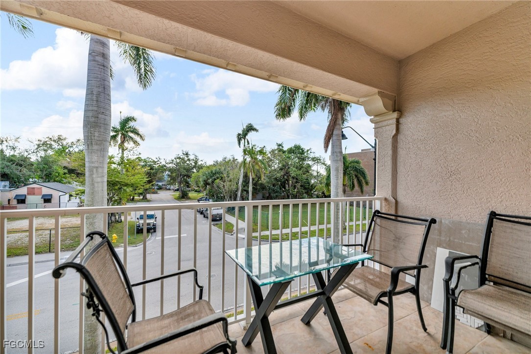 2080 West First Street, Unit 109 Fort Myers, FL 33901 - Photo 35 of 47 a view of a chair and table in the balcony