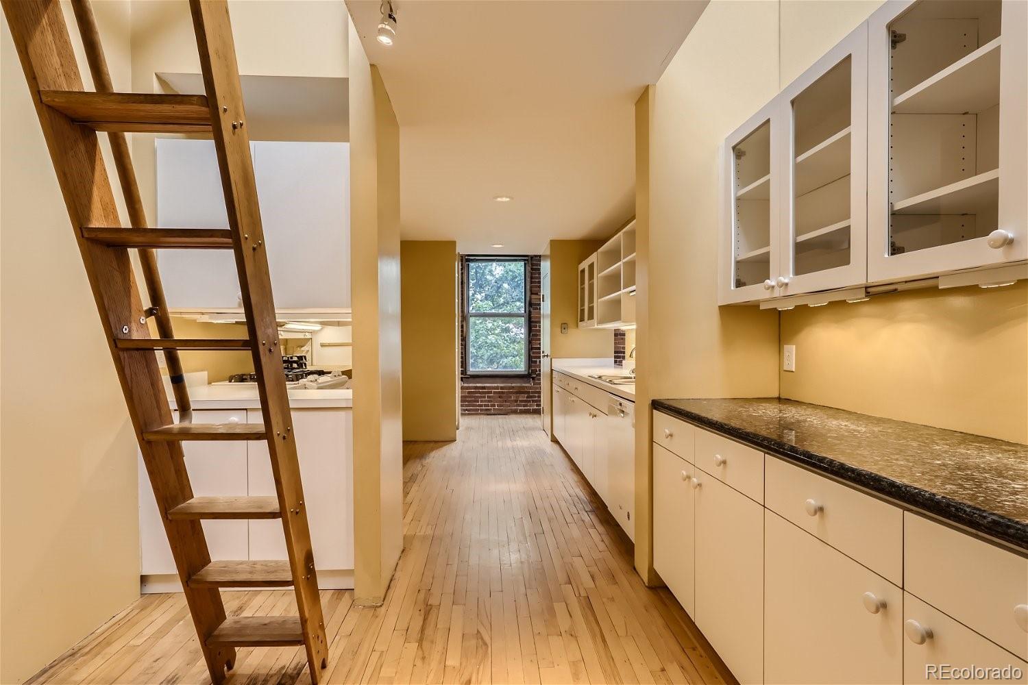 3349 Blake Street Denver, CO 80205 - Photo 20 of 28 a hallway with wooden floor