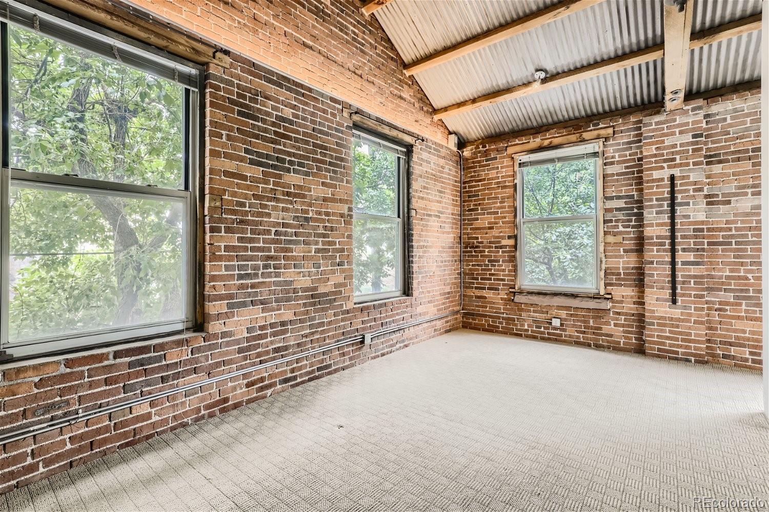 3349 Blake Street Denver, CO 80205 - Photo 21 of 28 a view of a room with a large window