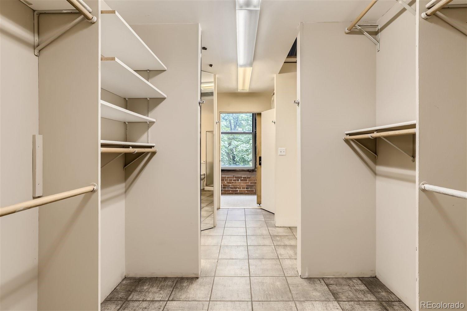 3349 Blake Street Denver, CO 80205 - Photo 23 of 28 a view of a hallway with white walls and entryway