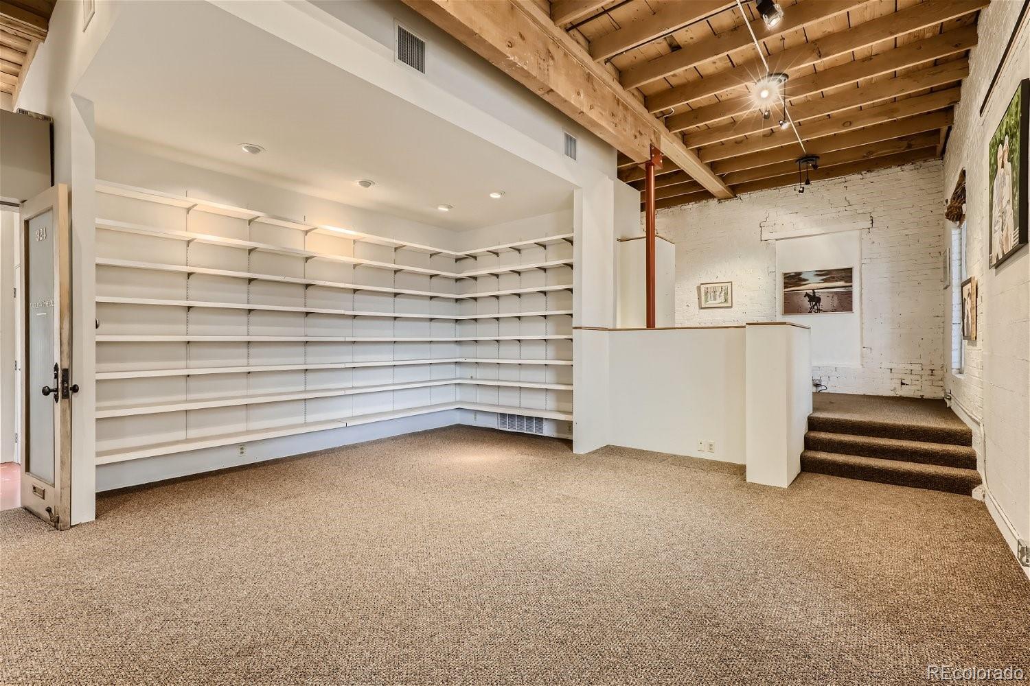 3349 Blake Street Denver, CO 80205 - Photo 7 of 28 a view of an empty room with a window