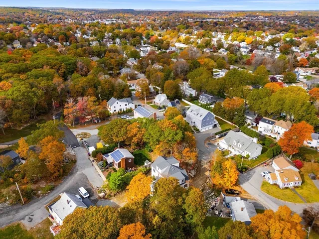 an aerial view of residential houses with outdoor space