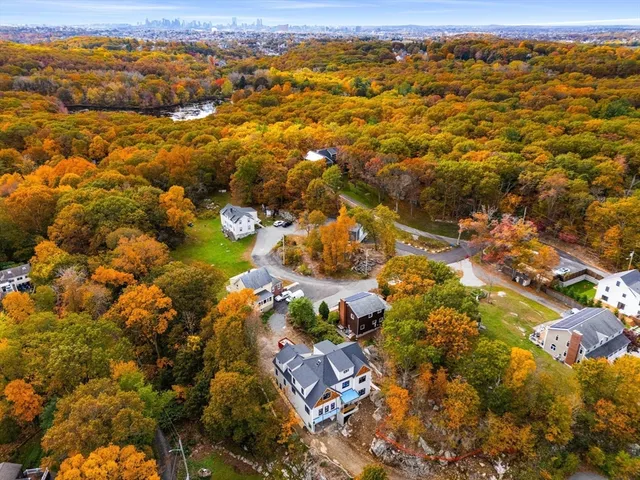 an aerial view of residential houses with outdoor space