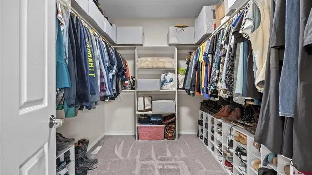 a bedroom with a bed and a potted plant