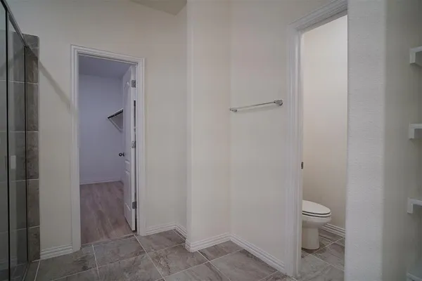 a bathroom with a shower and a sink