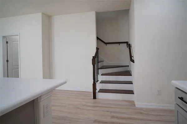 a room with table and a lamp