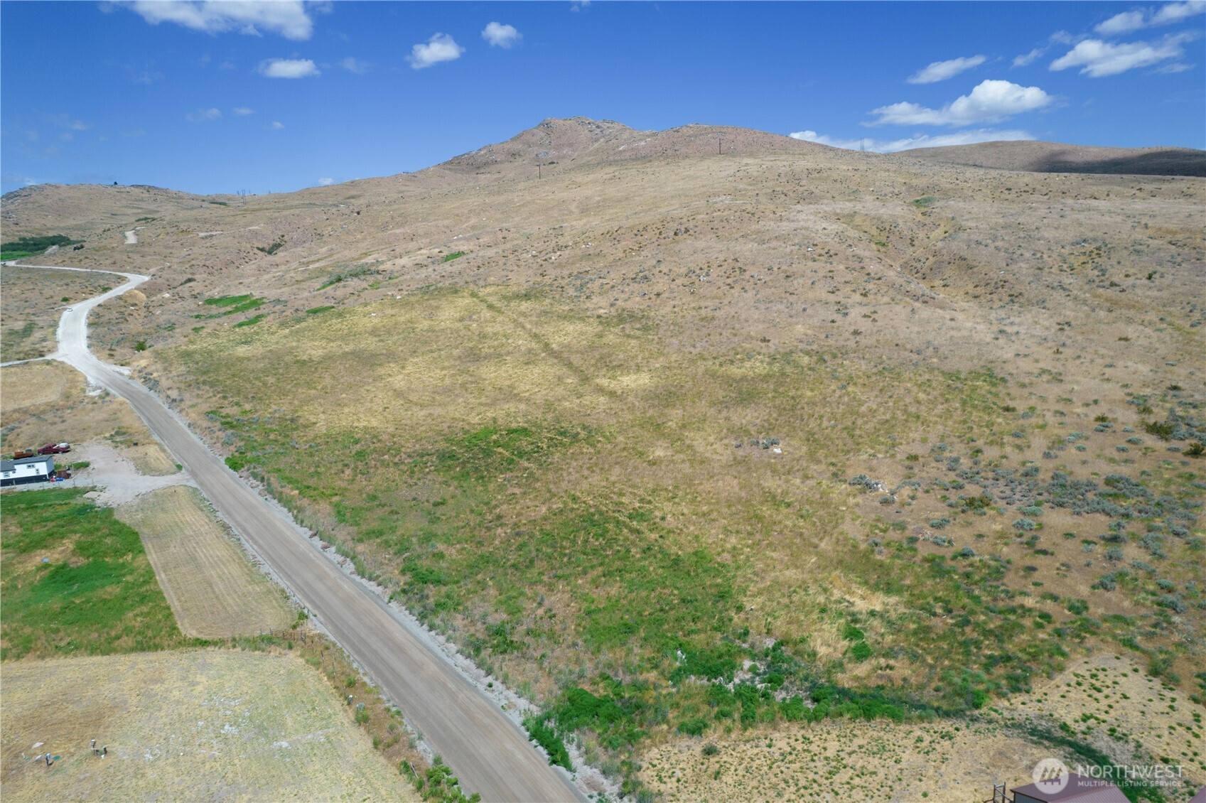 0 Bill Shaw Road Pateros, WA 98846 - Photo 19 of 32 a view of a dry yard with mountains in the background