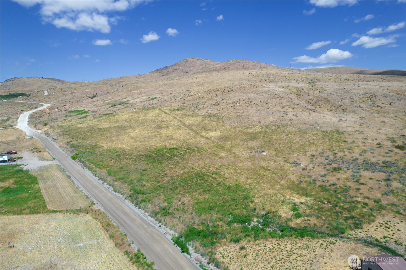 0 Bill Shaw Road Pateros, WA 98846 - Photo 20 of 32 a view of a dry yard with wooden fence