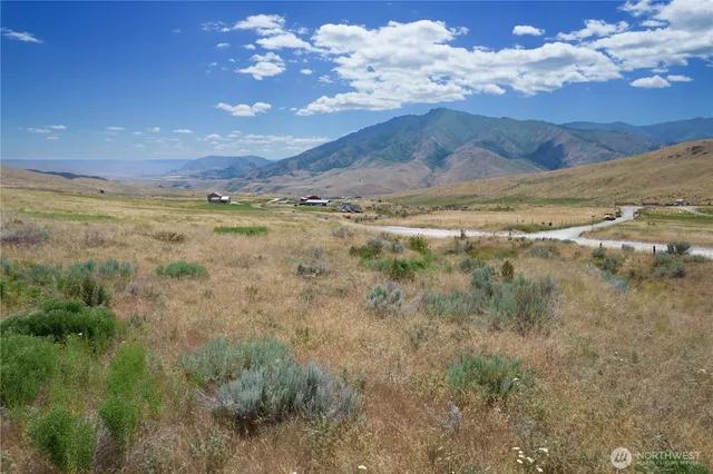 a view of mountain with sunset