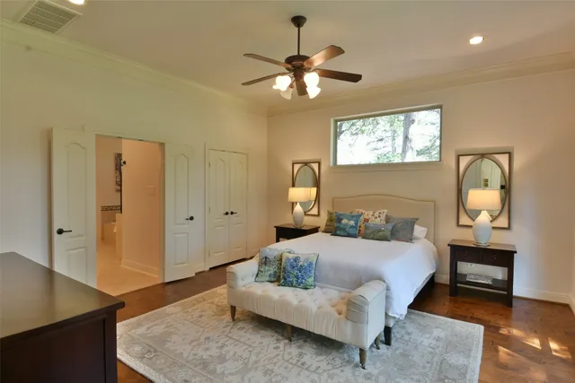 a bedroom with a bed and a chandelier