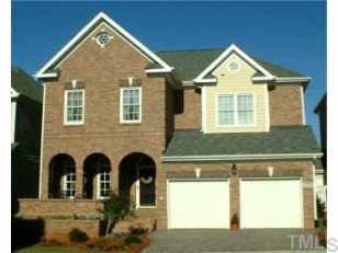 3908 Bentley Bridge Road Raleigh, NC 27612 - Photo 1 of 1 a front view of a house with garden