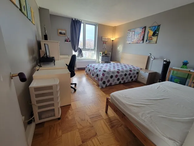 a bedroom with two beds and painted walls