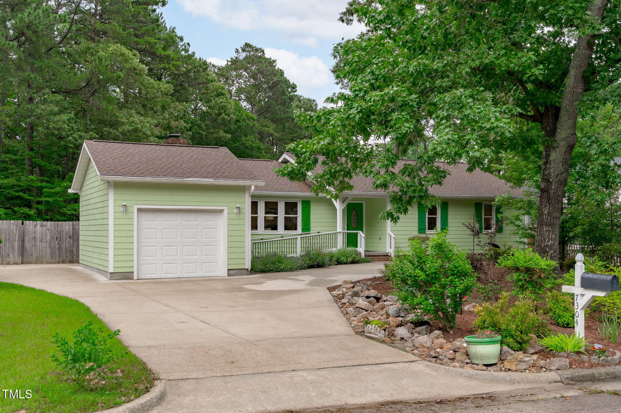 7304 St Ledger Drive Raleigh, NC 27613 - Photo 1 of 29 a front view of a house with a yard and a garage