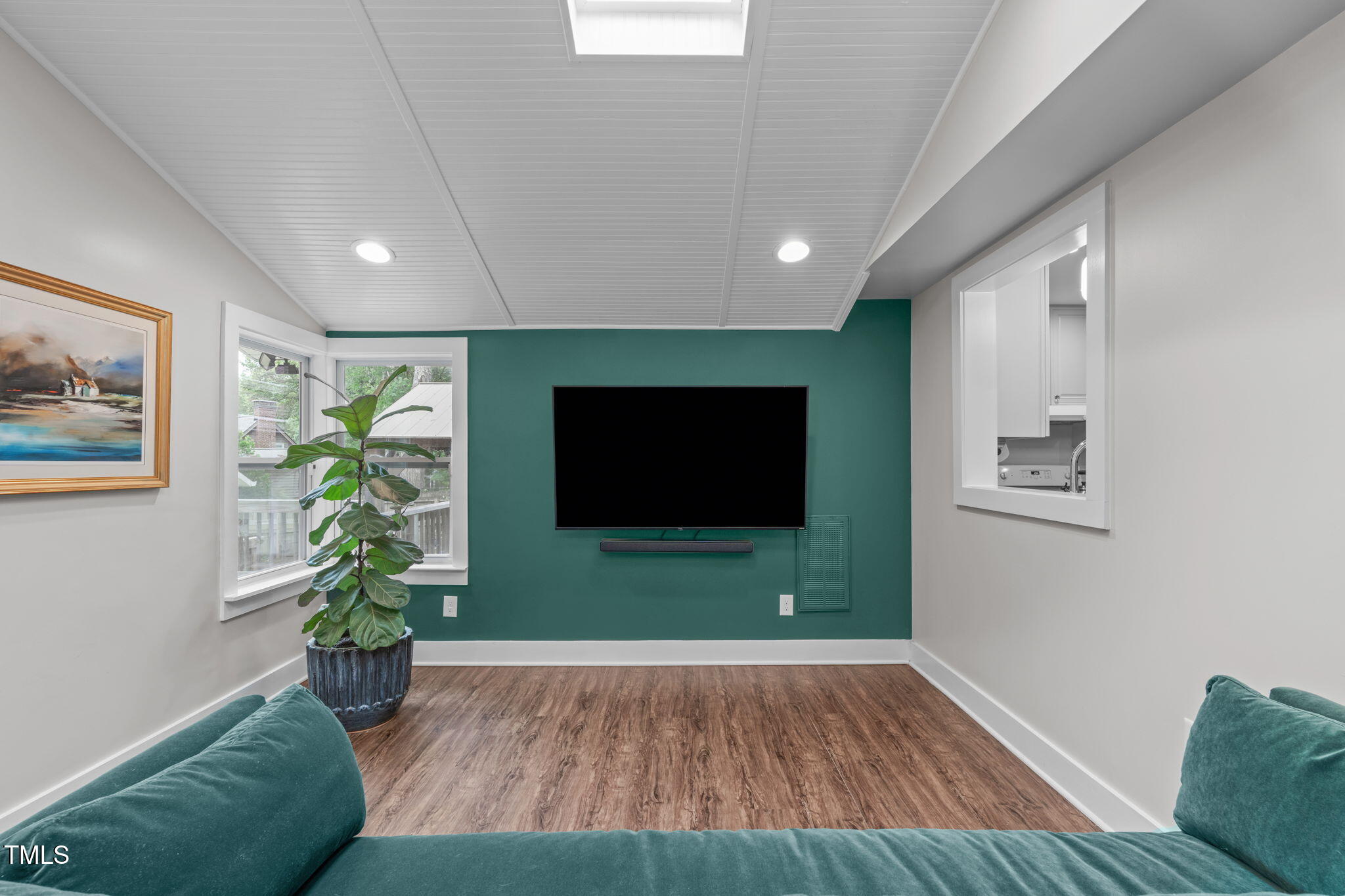 7304 St Ledger Drive Raleigh, NC 27613 - Photo 11 of 29 a living room with furniture and a flat screen tv