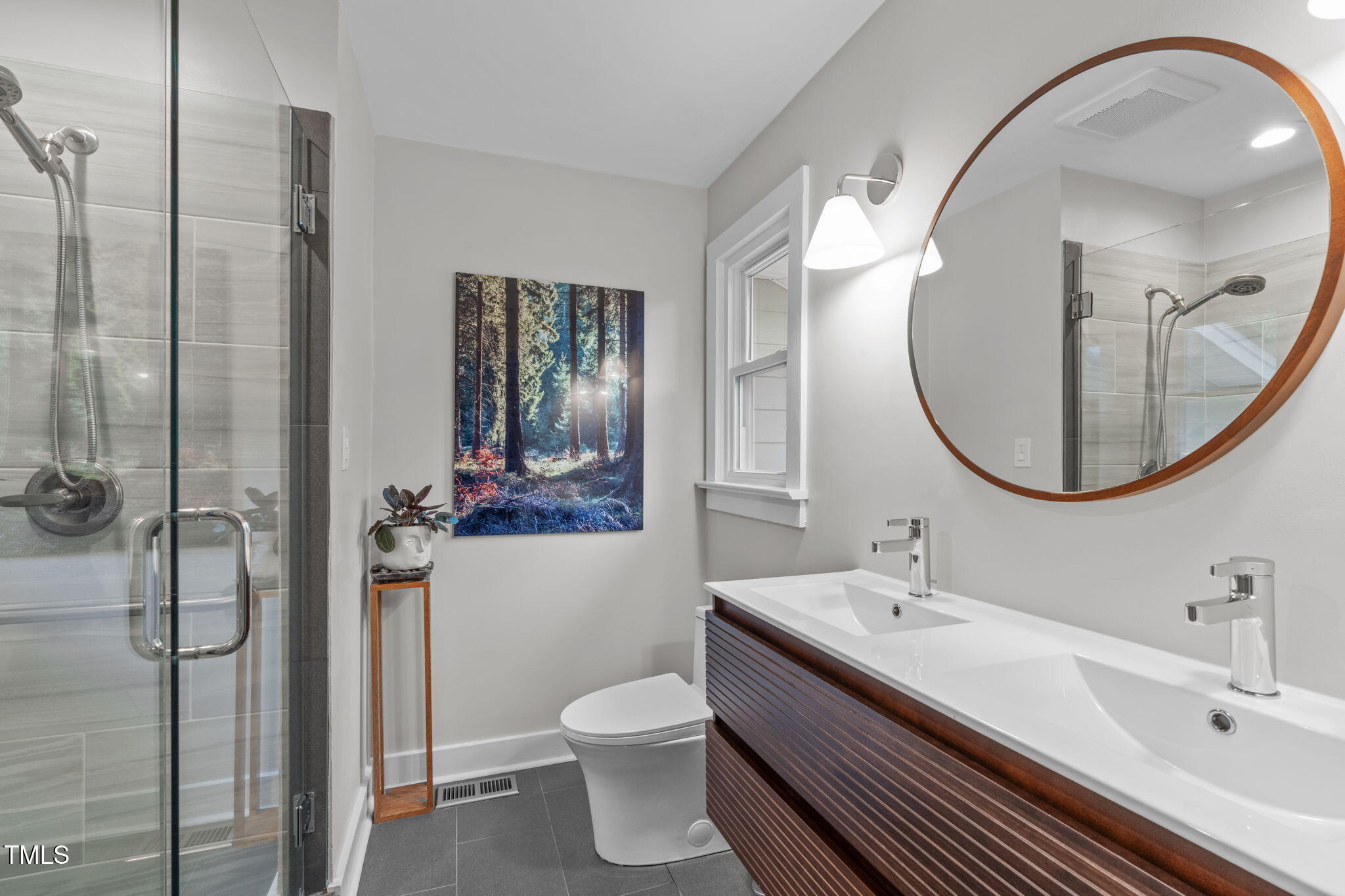 7304 St Ledger Drive Raleigh, NC 27613 - Photo 15 of 29 a bathroom with a sink and a mirror