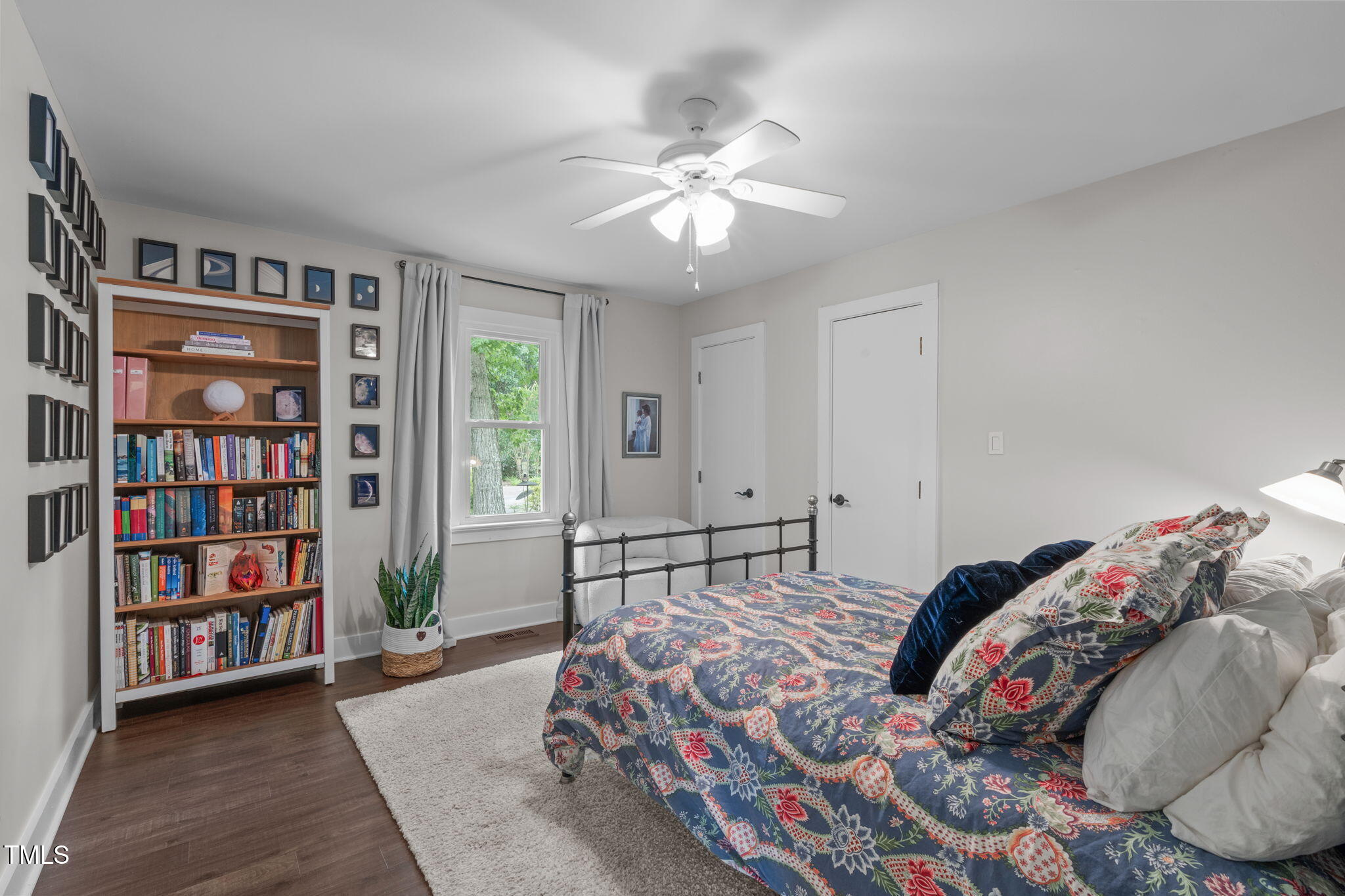 7304 St Ledger Drive Raleigh, NC 27613 - Photo 18 of 29 a bedroom with a bed and a book shelf