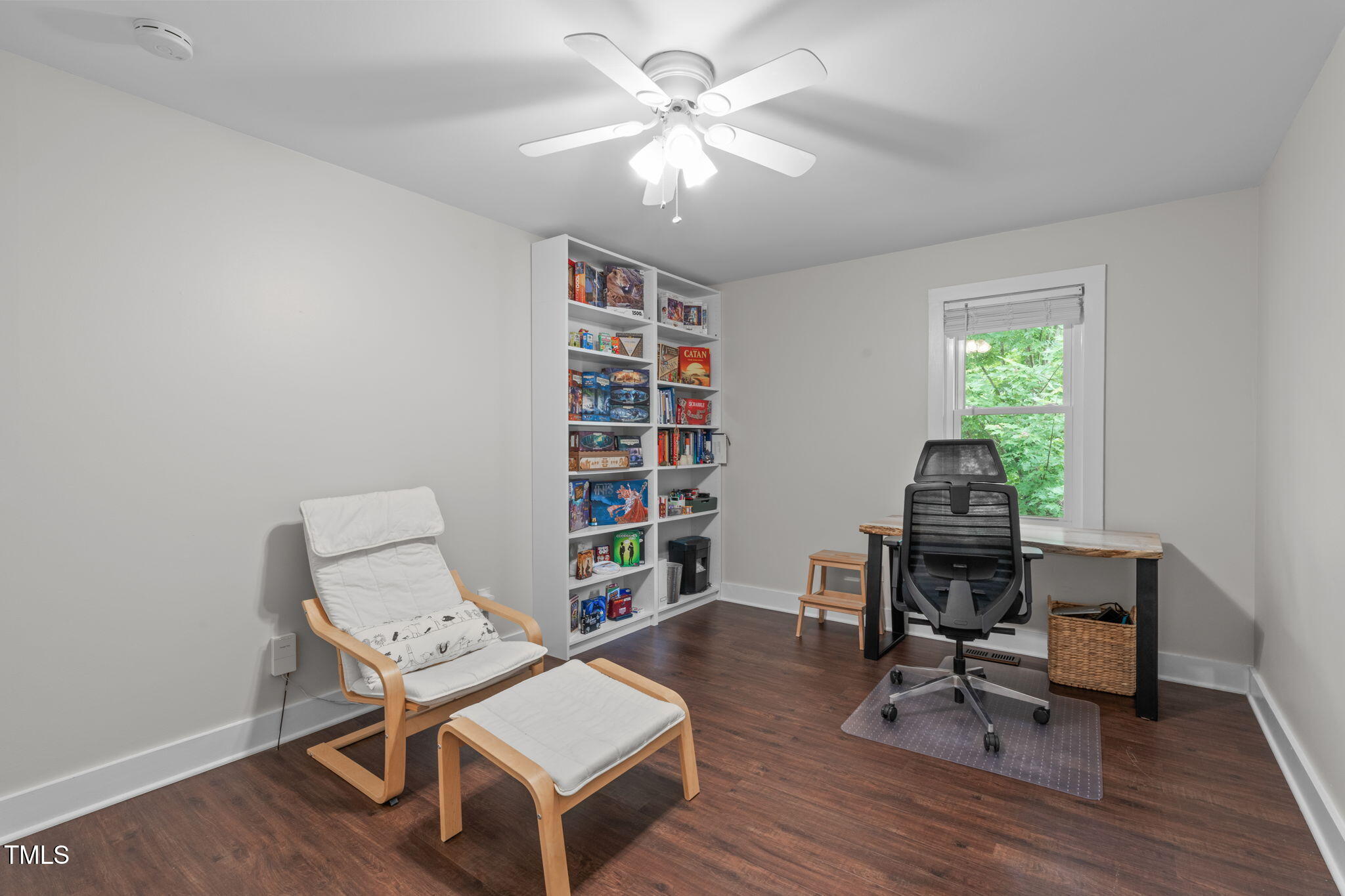 7304 St Ledger Drive Raleigh, NC 27613 - Photo 19 of 29 a workspace with furniture bookshelf and a window
