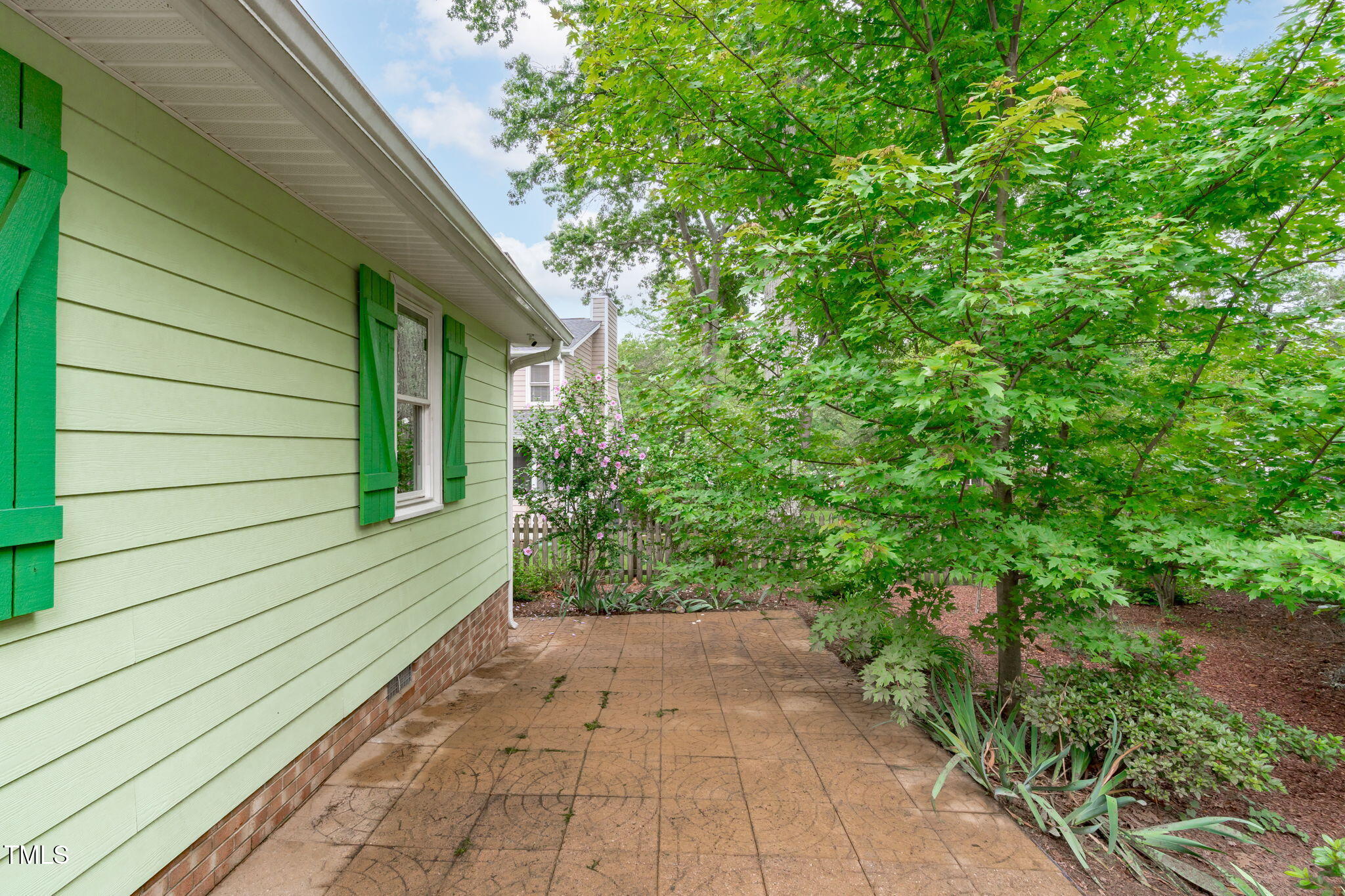 7304 St Ledger Drive Raleigh, NC 27613 - Photo 23 of 29 a view of a pathway both side of house