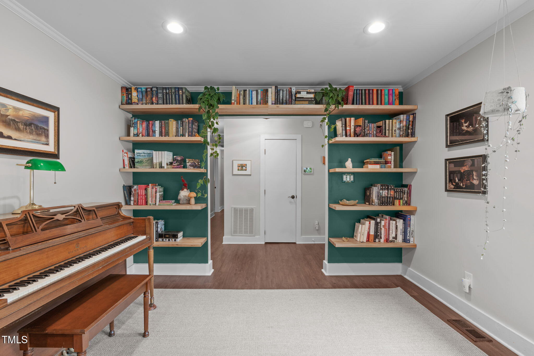 7304 St Ledger Drive Raleigh, NC 27613 - Photo 2 of 29 a room with furniture and a book shelf