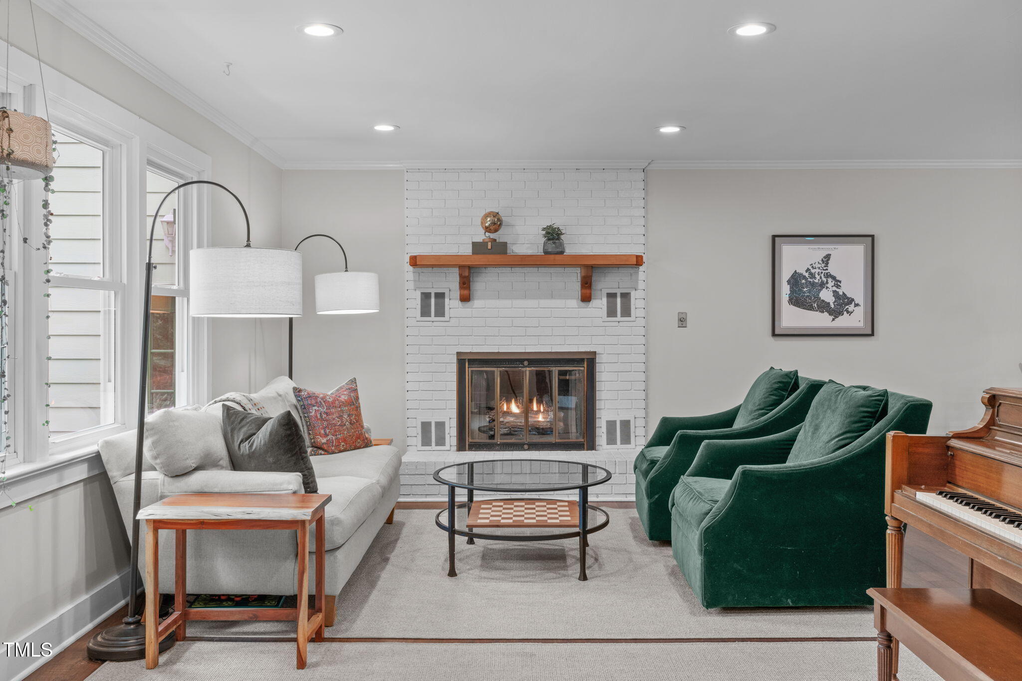 7304 St Ledger Drive Raleigh, NC 27613 - Photo 5 of 29 a living room with furniture and a fireplace