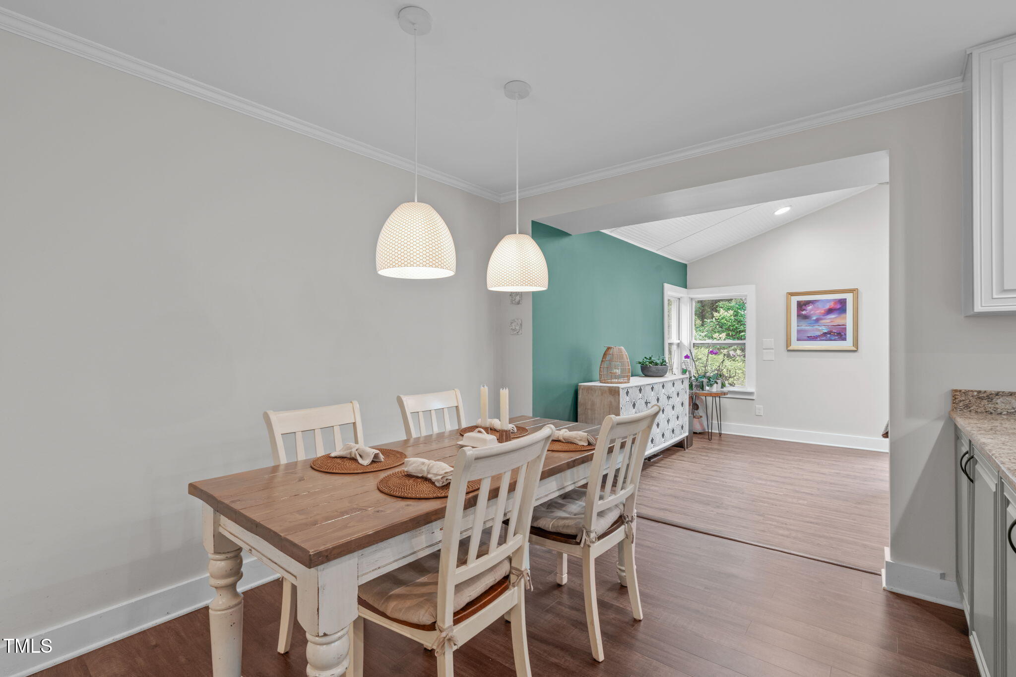 7304 St Ledger Drive Raleigh, NC 27613 - Photo 6 of 29 a view of a dining room with furniture and wooden floor