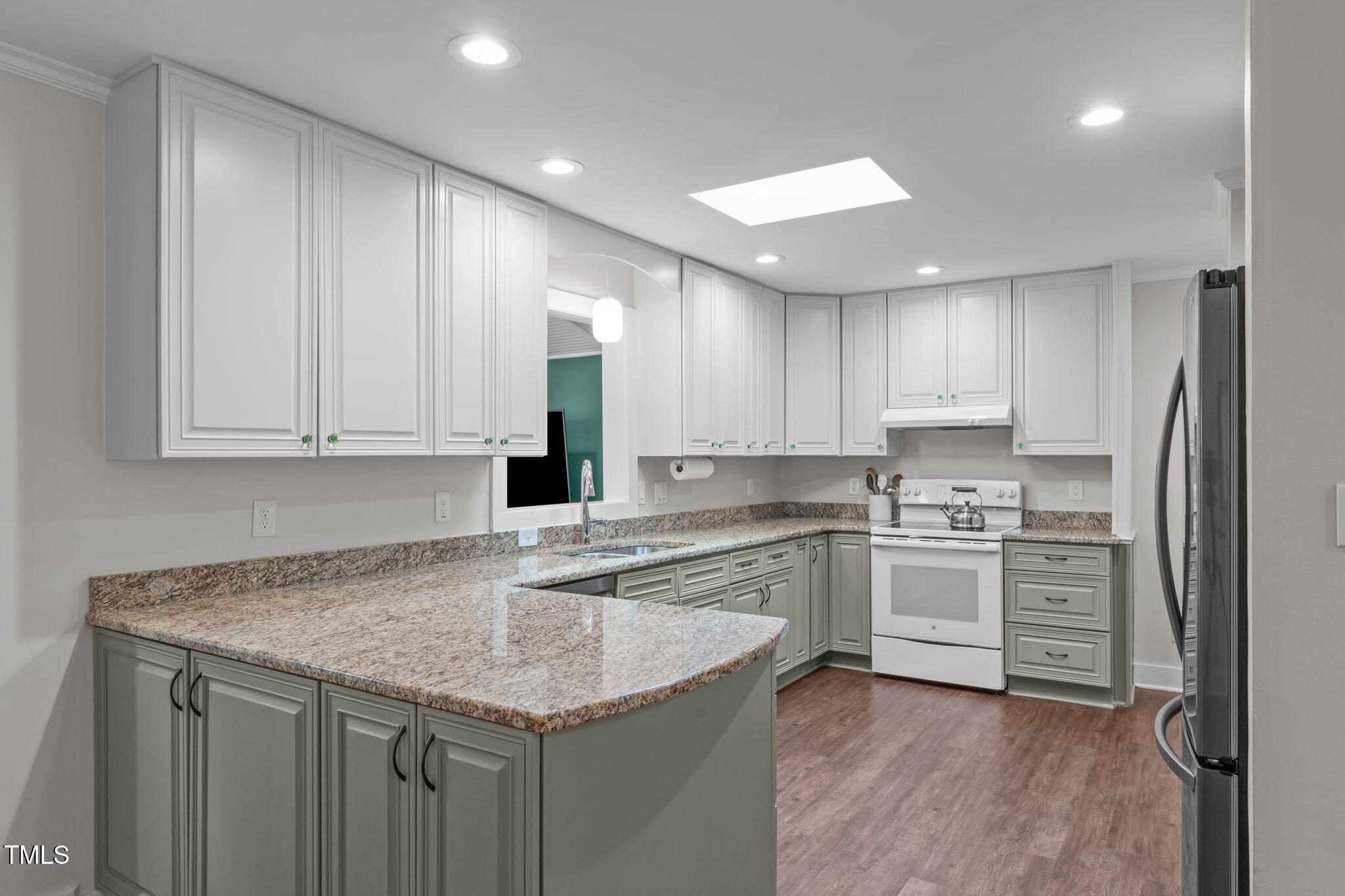 7304 St Ledger Drive Raleigh, NC 27613 - Photo 8 of 29 a kitchen with stainless steel appliances granite countertop a sink stove and refrigerator