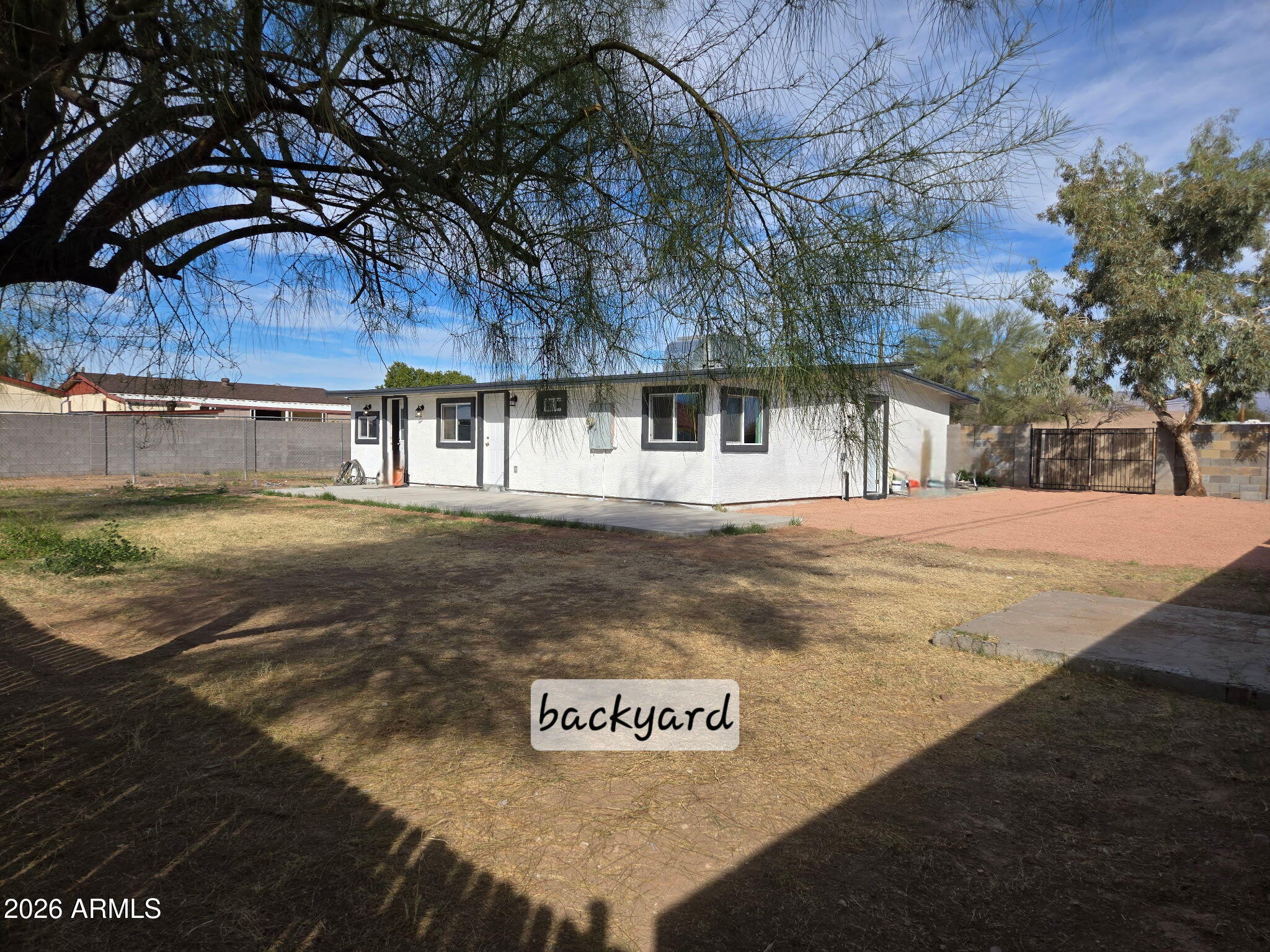 770 South Pinal Drive Apache Junction, AZ 85120 - Photo 11 of 51 a view of a white house with a yard