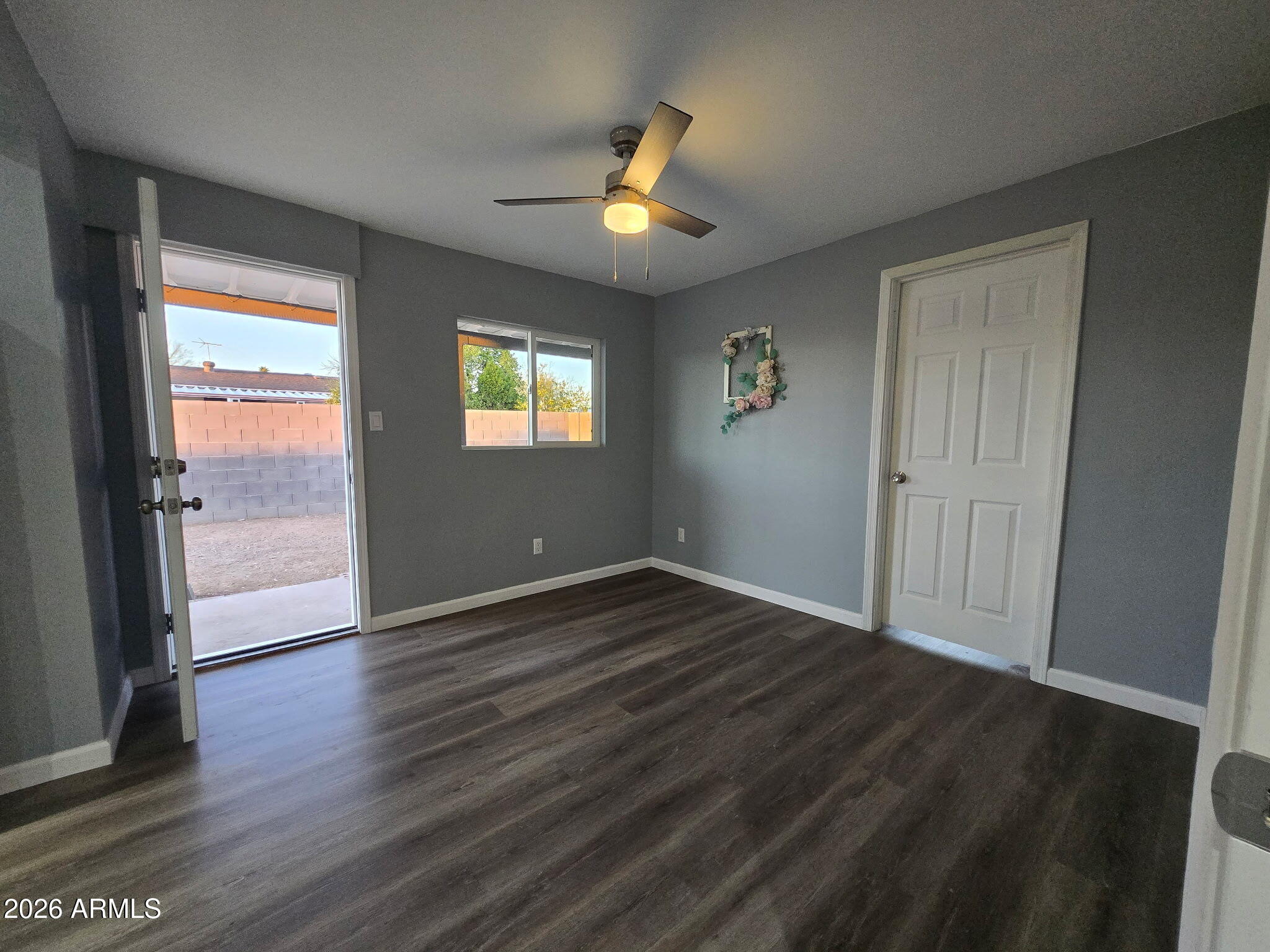 770 South Pinal Drive Apache Junction, AZ 85120 - Photo 16 of 51 an empty room with wooden floor and windows