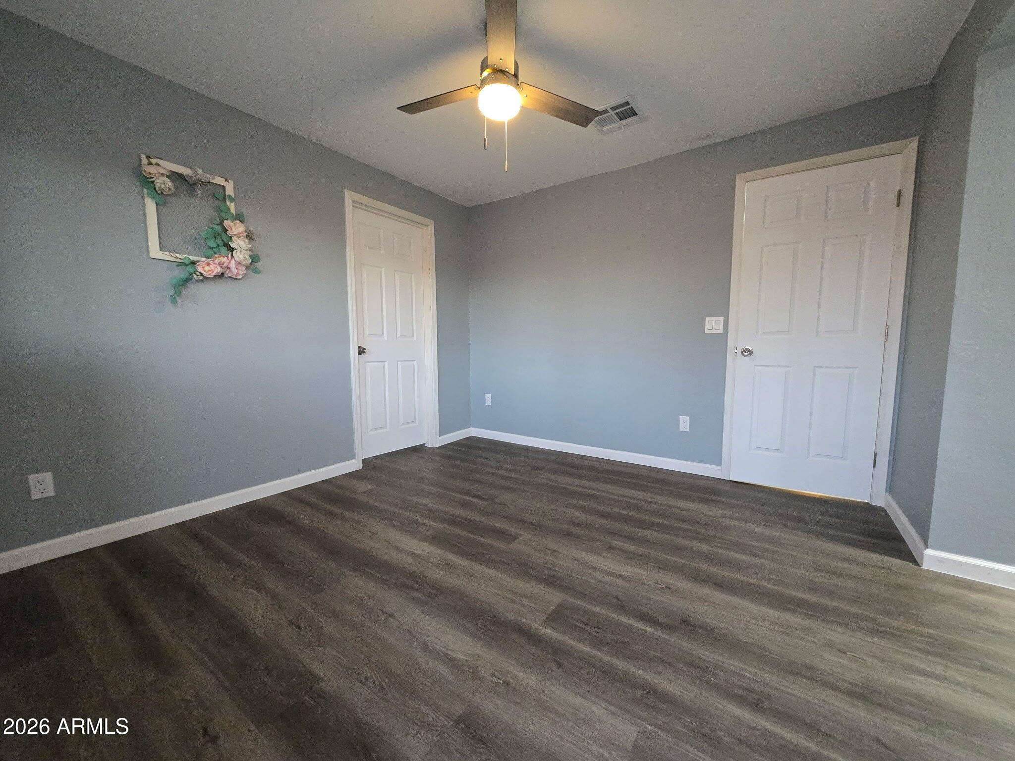770 South Pinal Drive Apache Junction, AZ 85120 - Photo 17 of 51 a view of empty room with wooden floor