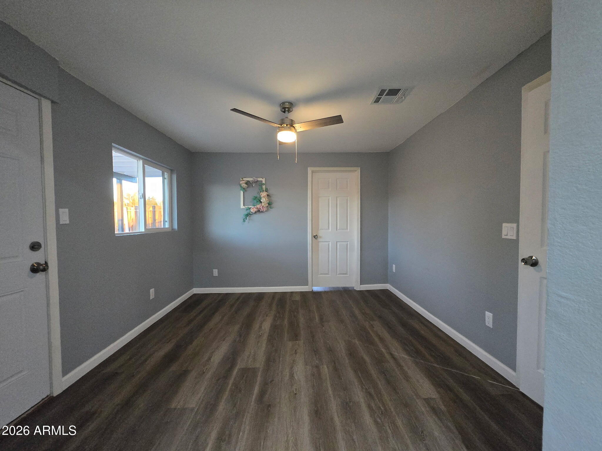 770 South Pinal Drive Apache Junction, AZ 85120 - Photo 18 of 51 wooden floor in an empty room with a window