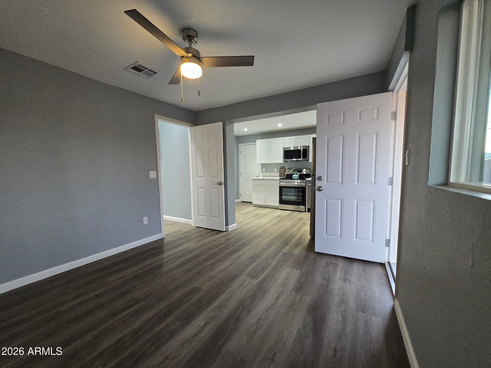 770 South Pinal Drive Apache Junction, AZ 85120 - Photo 20 of 51 wooden floor in an empty room with a window
