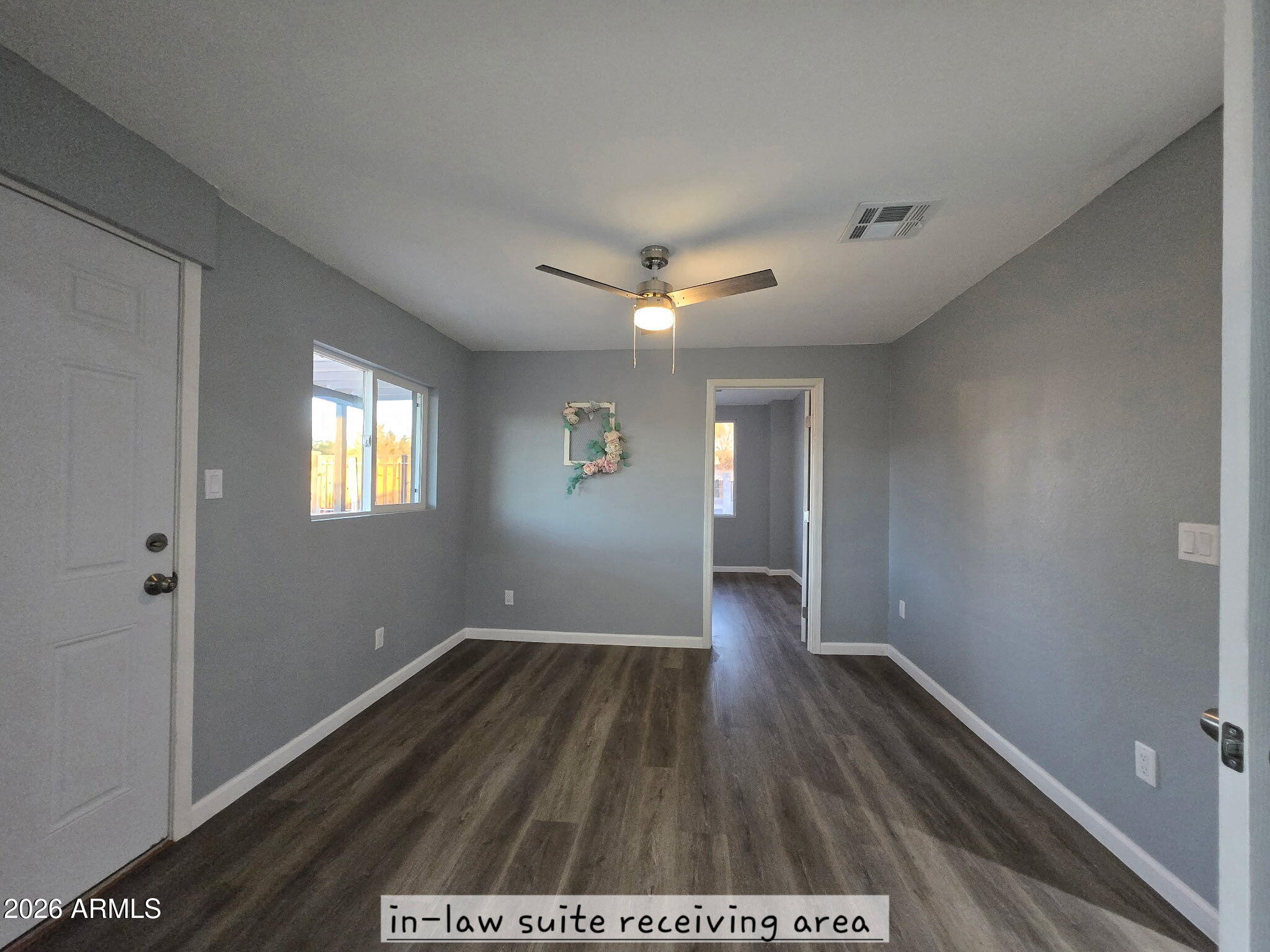 770 South Pinal Drive Apache Junction, AZ 85120 - Photo 21 of 51 a view of an empty room with wooden floor and a window