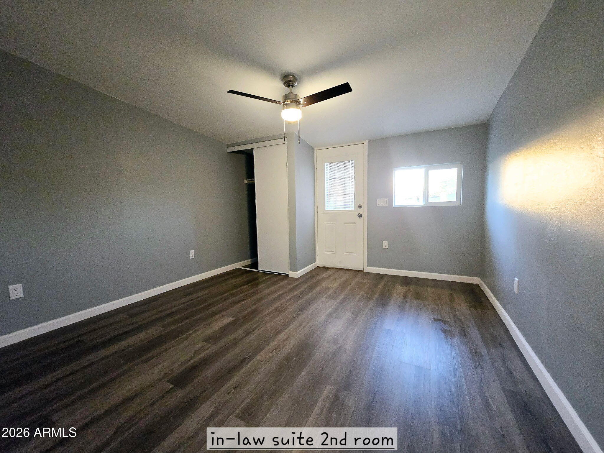 770 South Pinal Drive Apache Junction, AZ 85120 - Photo 23 of 51 an empty room with wooden floor and windows