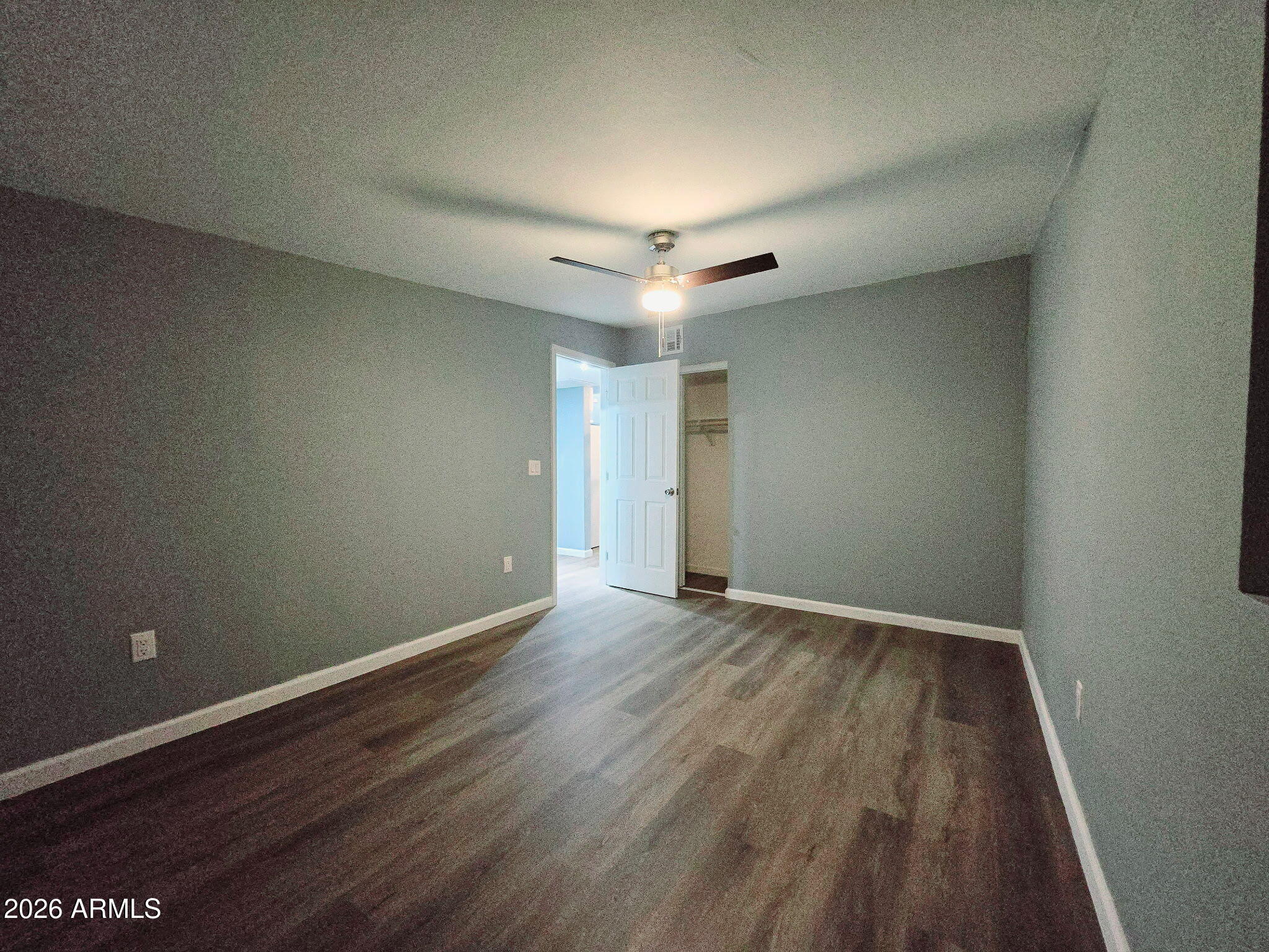 770 South Pinal Drive Apache Junction, AZ 85120 - Photo 39 of 51 a view of an empty room with wooden floor