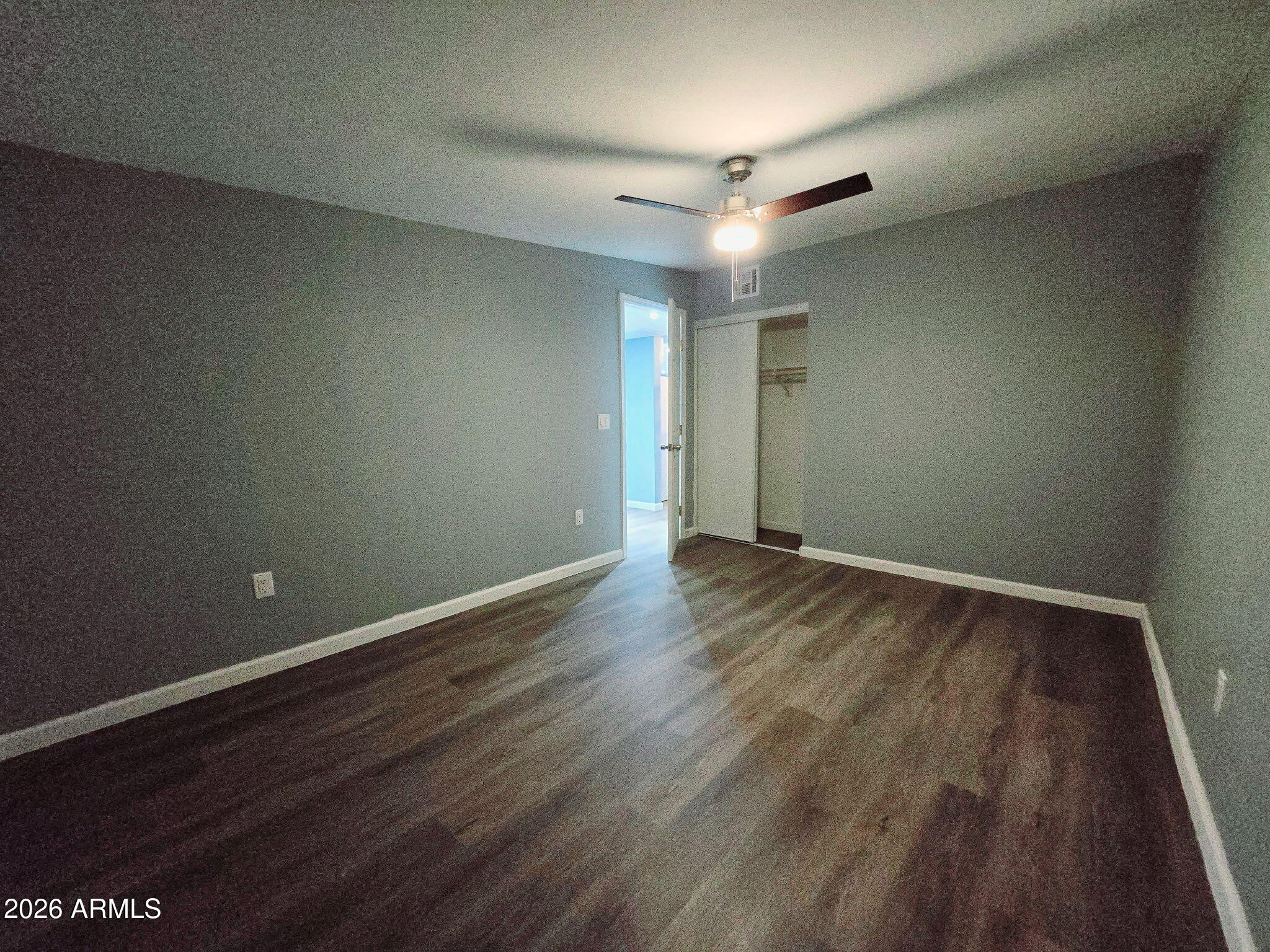 770 South Pinal Drive Apache Junction, AZ 85120 - Photo 40 of 51 an empty room with wooden floor and windows