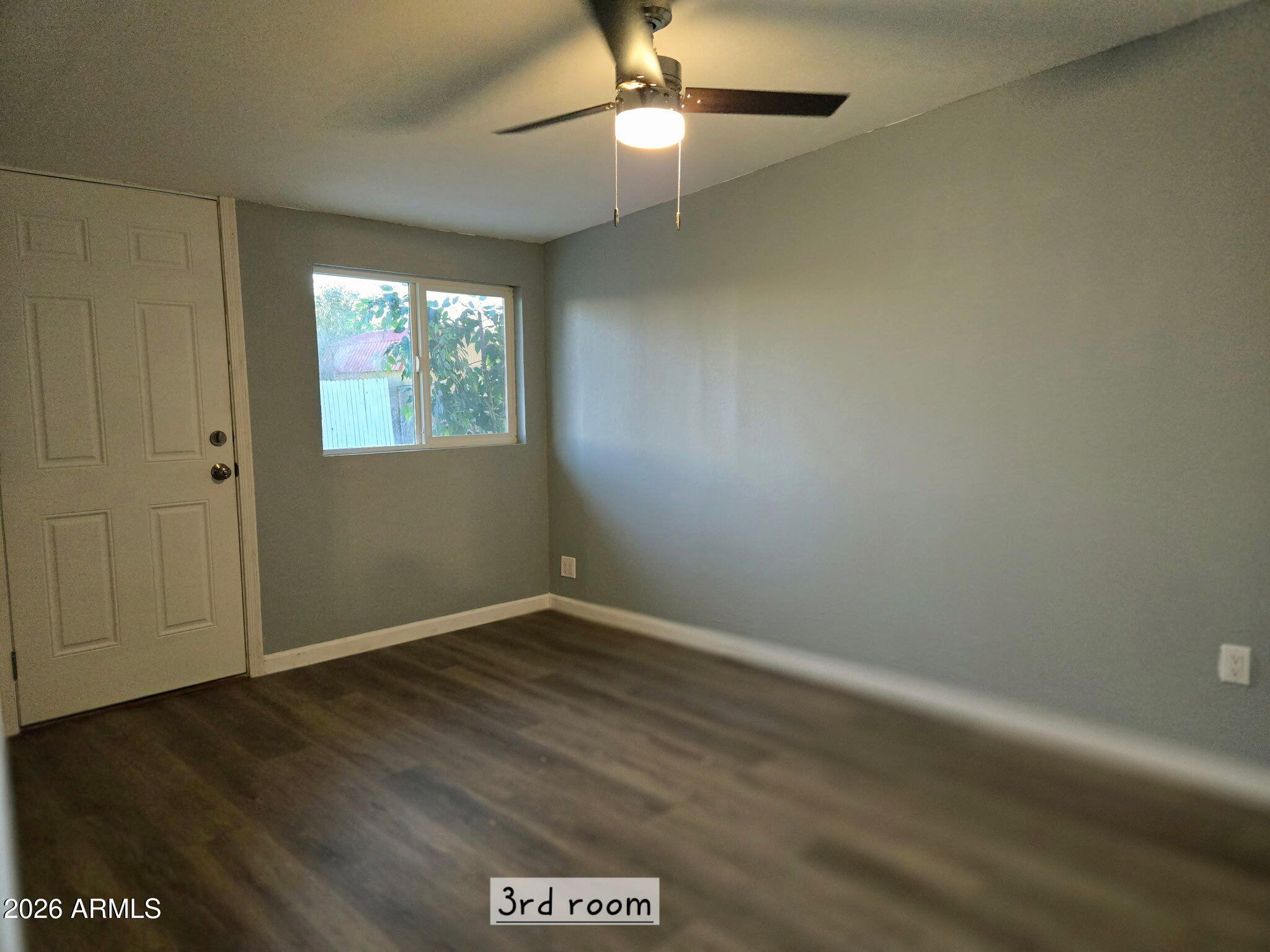 770 South Pinal Drive Apache Junction, AZ 85120 - Photo 41 of 51 an empty room with wooden floor closet and windows