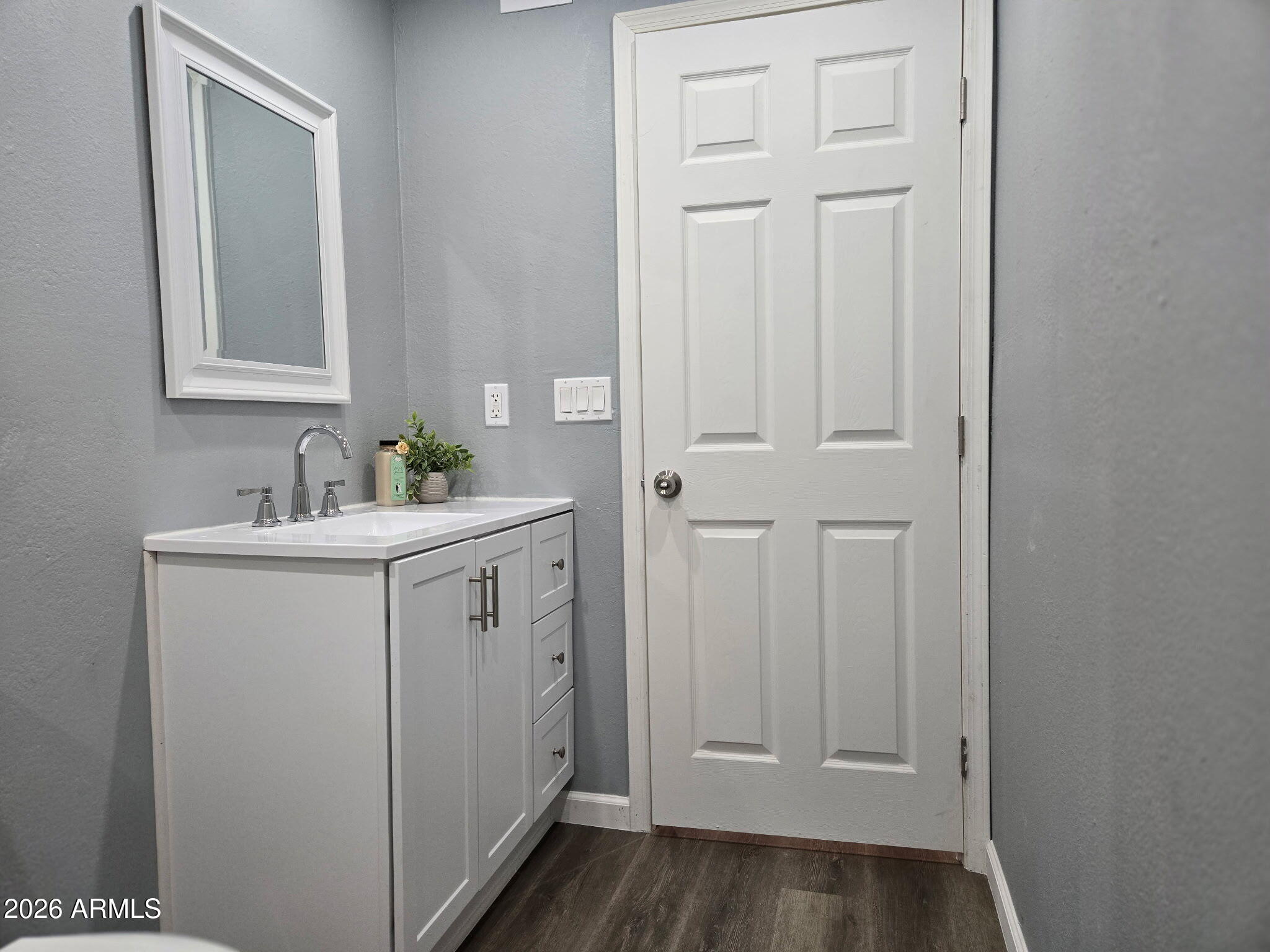 770 South Pinal Drive Apache Junction, AZ 85120 - Photo 49 of 51 a bathroom with a sink and a mirror