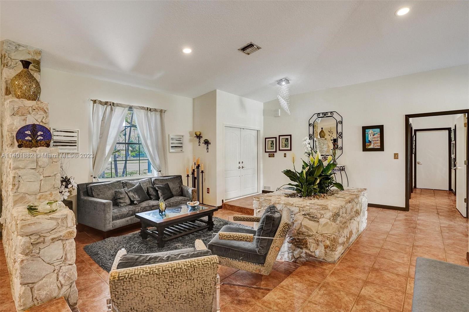 15971 Southwest 252nd Street Homestead, FL 33031 - Photo 11 of 92 a living room with furniture and wooden floor