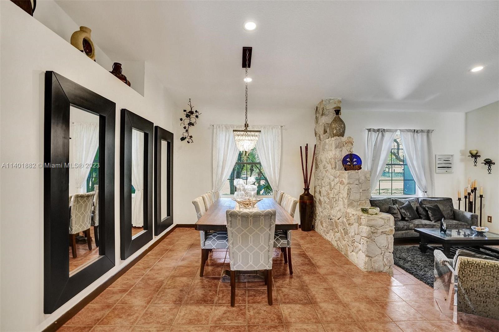 15971 Southwest 252nd Street Homestead, FL 33031 - Photo 15 of 92 a view of a dining room with furniture window and wooden floor