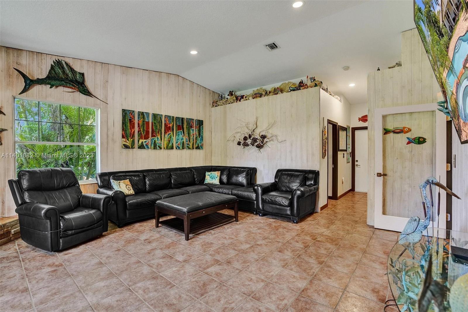 15971 Southwest 252nd Street Homestead, FL 33031 - Photo 30 of 92 a living room with furniture
