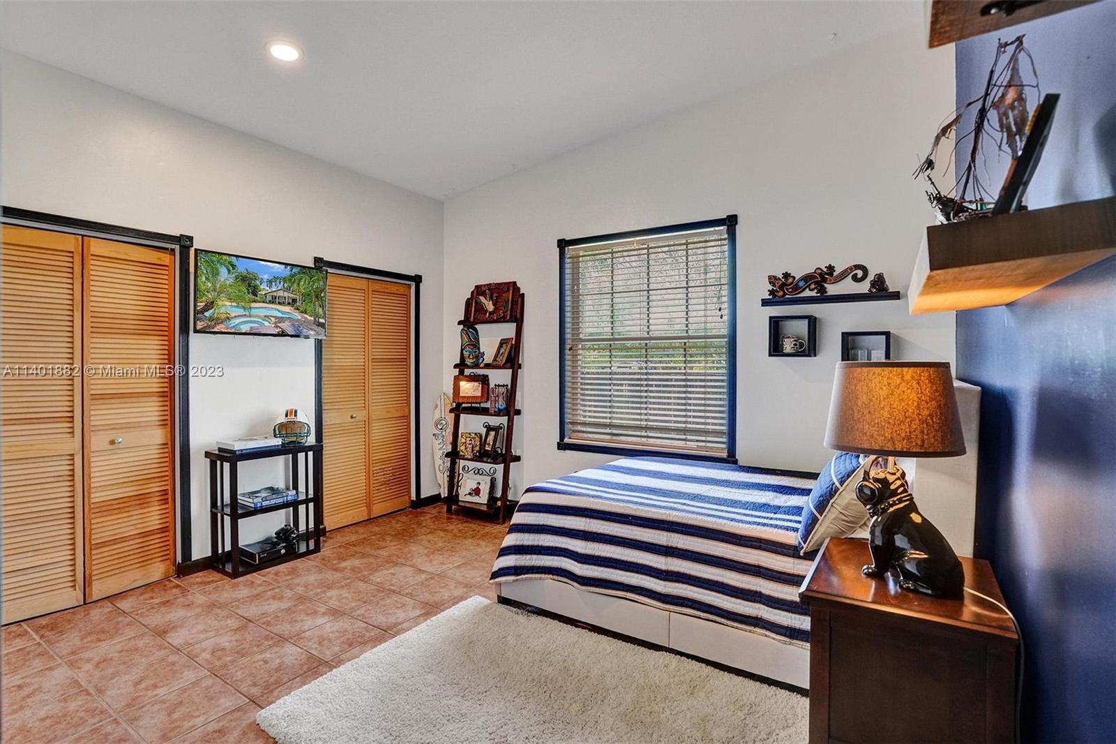 15971 Southwest 252nd Street Homestead, FL 33031 - Photo 34 of 92 a room with furniture and a window