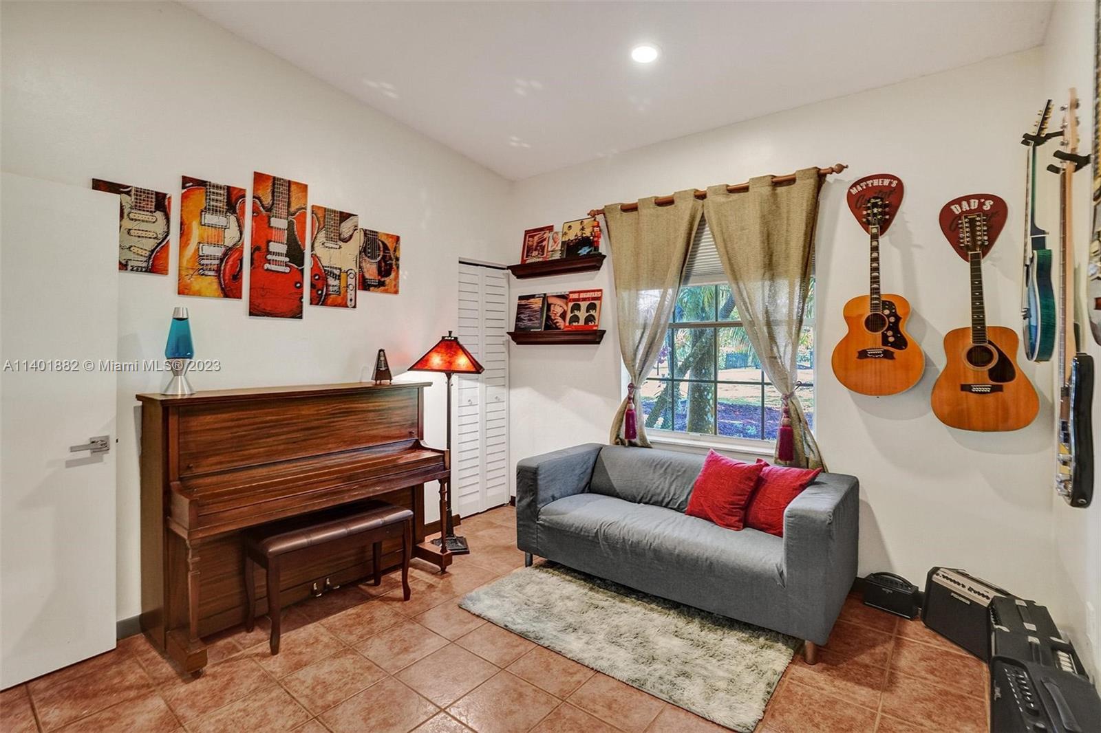 15971 Southwest 252nd Street Homestead, FL 33031 - Photo 40 of 92 a living room with furniture and a wooden floor