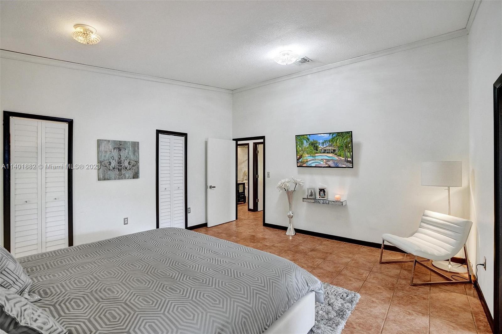 15971 Southwest 252nd Street Homestead, FL 33031 - Photo 46 of 92 a bedroom with a bed and a couch